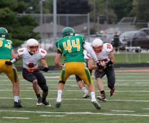 Hos Smith has a Bergan defender in his path with OC's Ben Ward headed his way. Photo Credit/Cheri Droescher. 