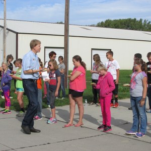 Larry Howard, Nebraska Extension Educator in Cuming County explains how to use a compass to these Oakland-Craig 5th graders during the GPS workshop in West Point.