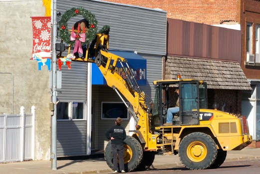 Oakland city employees Bryan Johnson and Mike Francis put up the Christmas decorations last week on Oakland's Main Street. Photo Credit/Denise Gilliland, Editor and Chief, Kat Country Hub. 